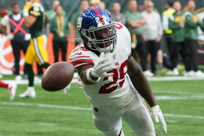 New York Giants safety Xavier McKinney (29) attempts to catch the ball against the Green Bay Packers in the second half during an NFL International Series game at Tottenham Hotspur Stadium.